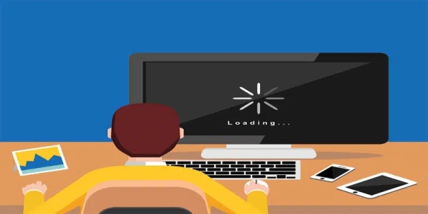 A person sitting at a computer AI-generated content may be incorrect.